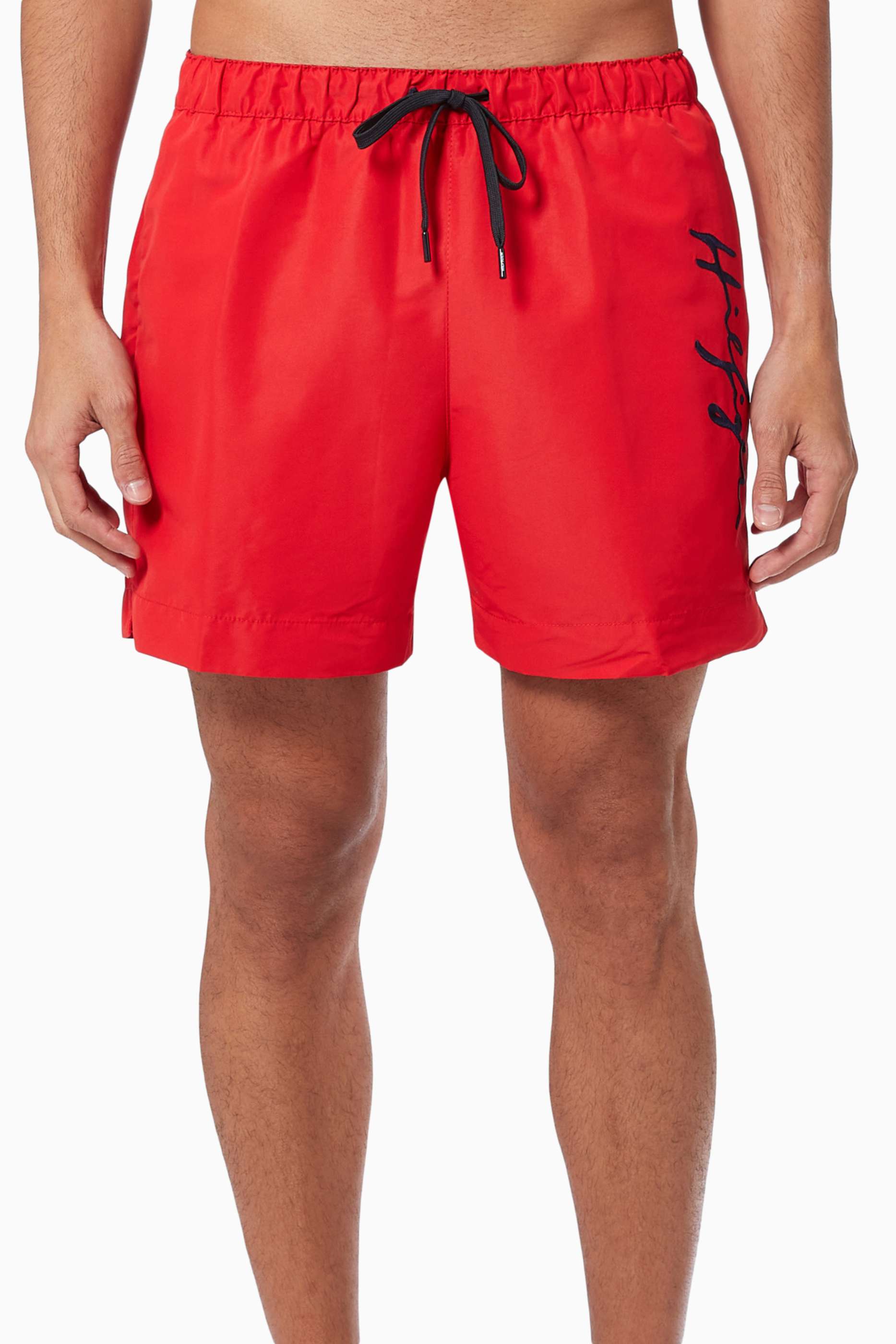 Shop Tommy Hilfiger Blue Signature Logo Mid-length Swim Shorts in 